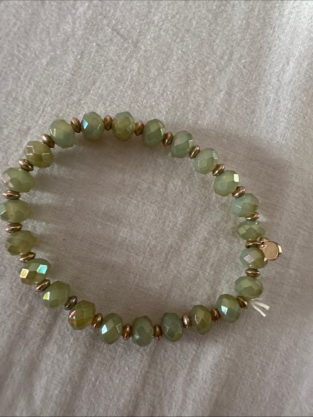 Faceted Light Green Bead Stretch Bracelet with Gold Accents